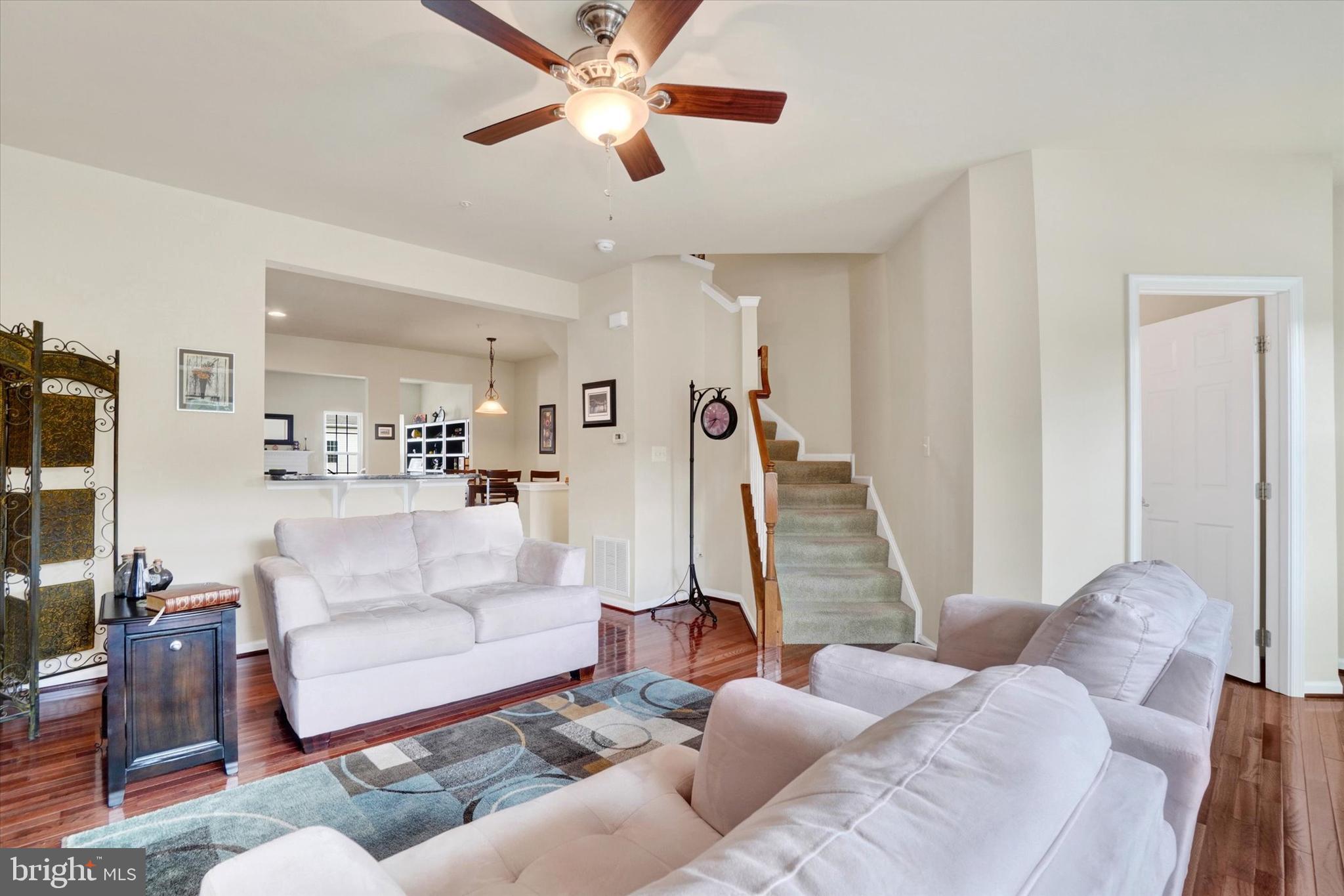 1269 Stonehaven Way, Unit 83 York, PA 17403 - Photo 16 of 28 a living room with furniture and a wooden floor