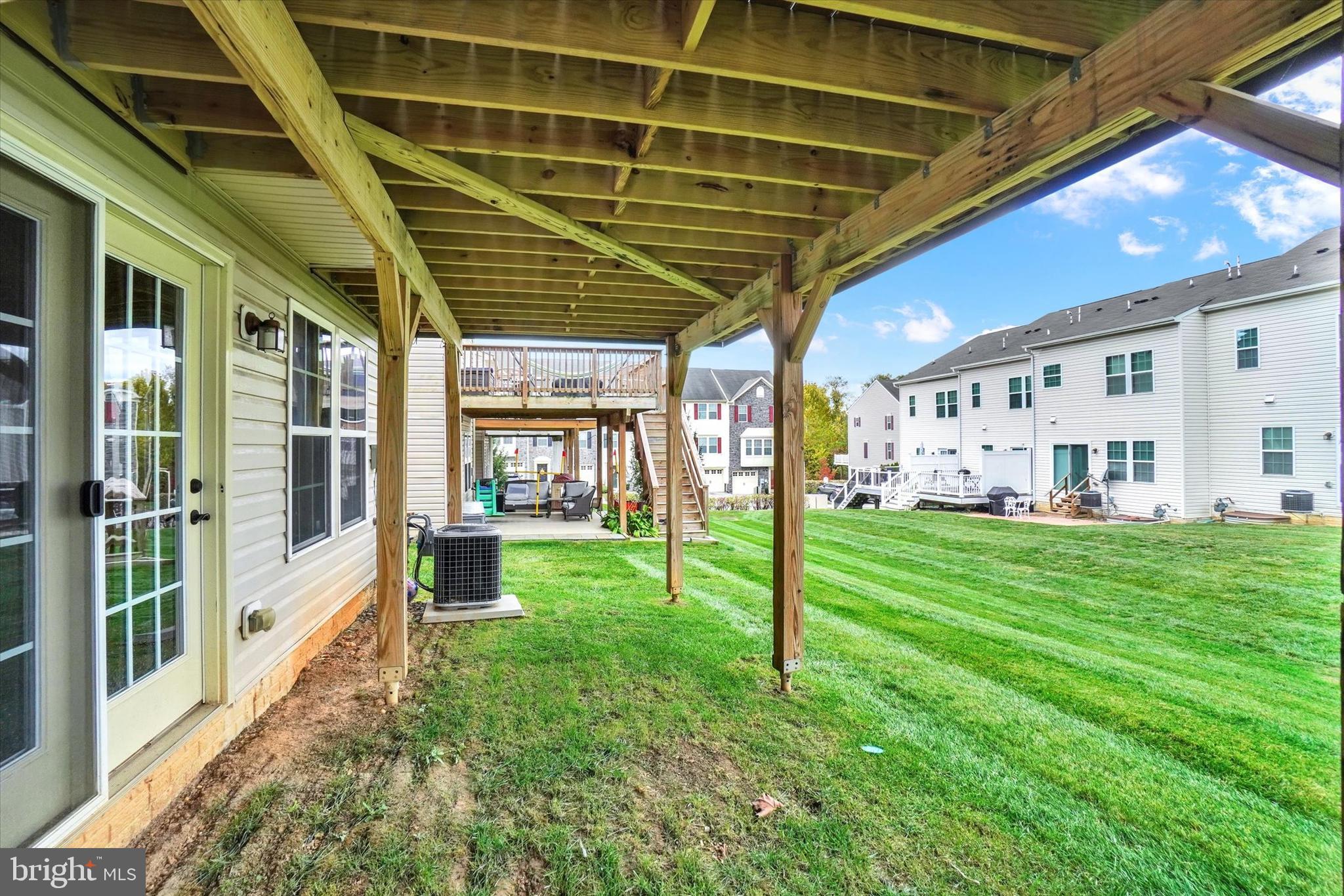 1269 Stonehaven Way, Unit 83 York, PA 17403 - Photo 27 of 28 a view of a porch with furniture and garden