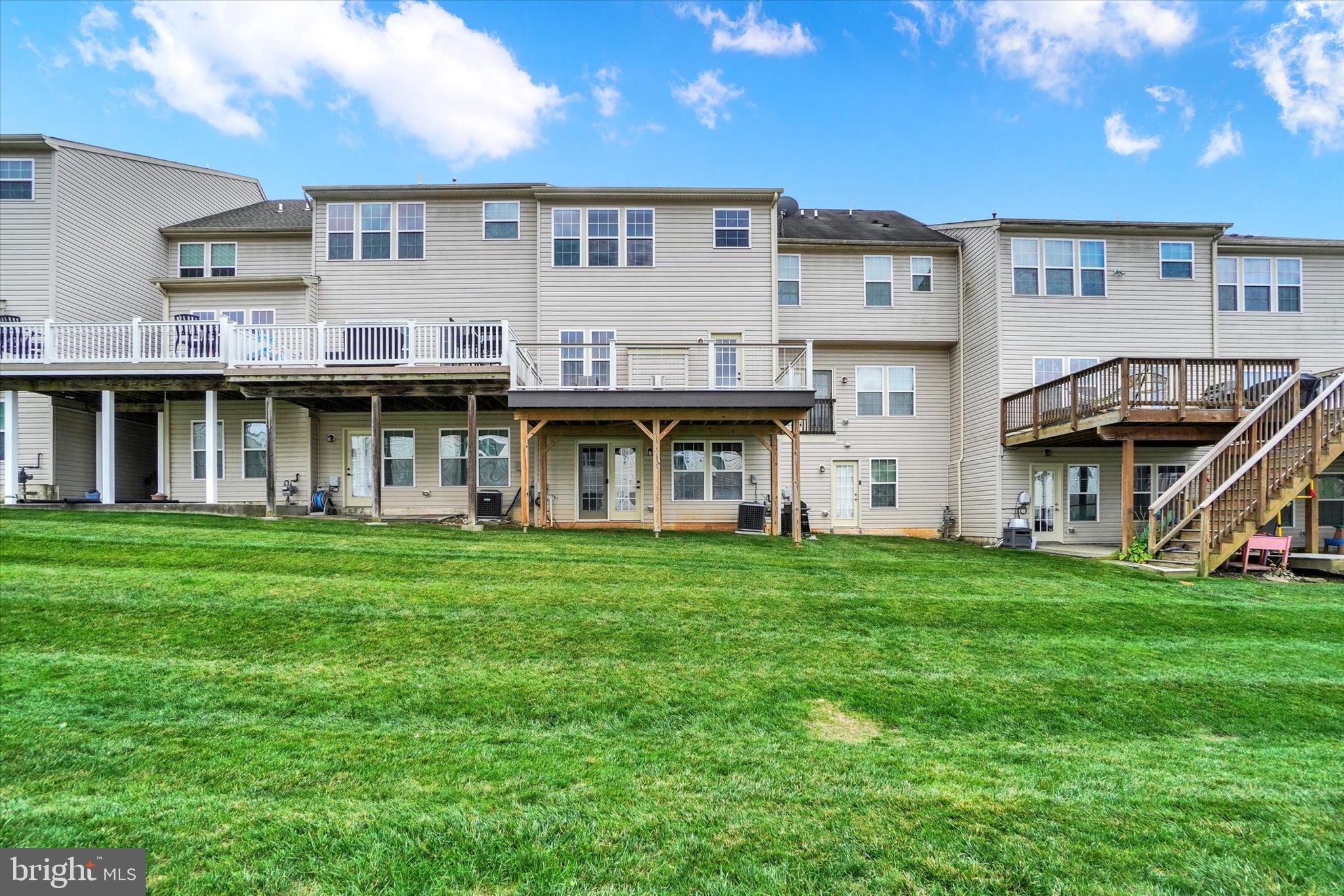 1269 Stonehaven Way, Unit 83 York, PA 17403 - Photo 28 of 28 a view of a big house with a big yard and large trees
