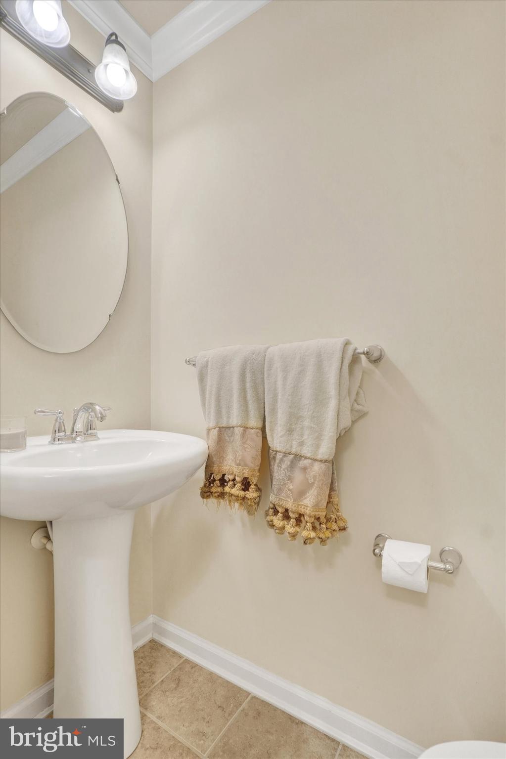 1269 Stonehaven Way, Unit 83 York, PA 17403 - Photo 5 of 28 a bathroom with a sink and a mirror