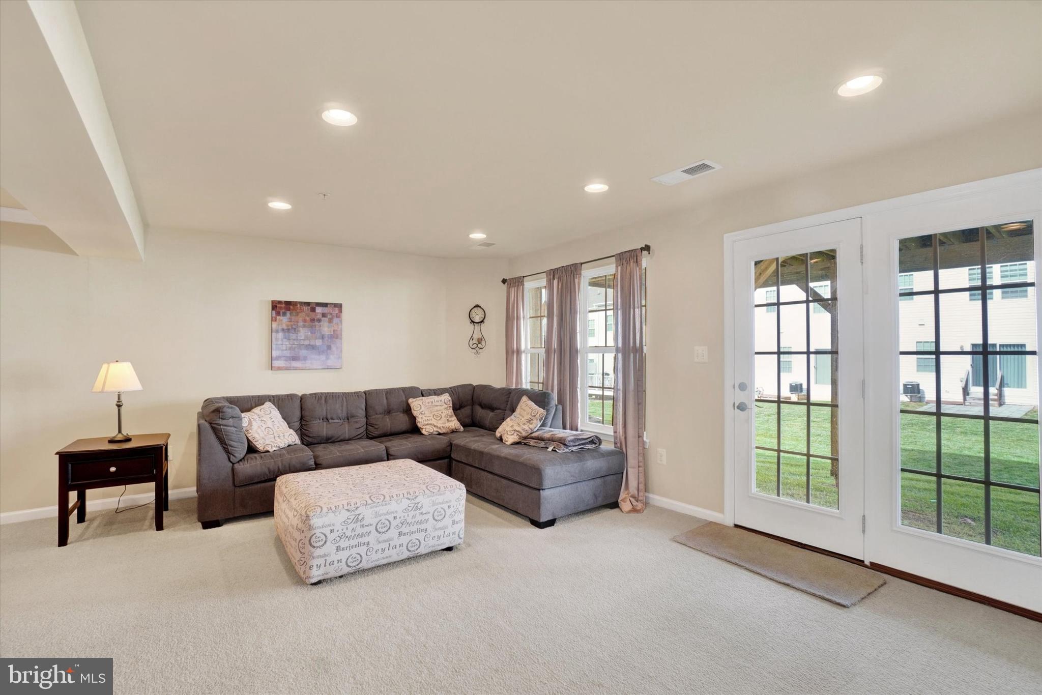1269 Stonehaven Way, Unit 83 York, PA 17403 - Photo 7 of 28 a living room with furniture and a window