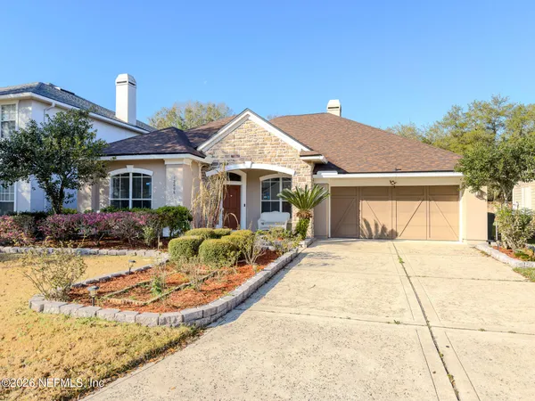 a front view of a house with yard outdoor seating and barbeque oven