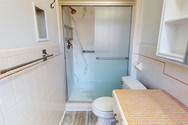 a bathroom with a sink and toilet