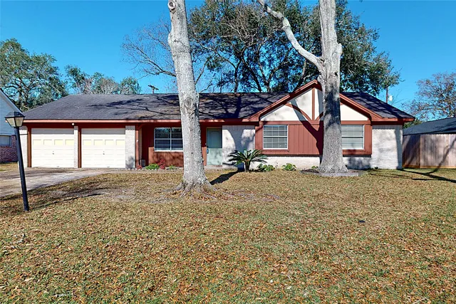 a house that has a tree in front of it