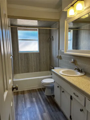 a bathroom with a sink a toilet and a bathtub