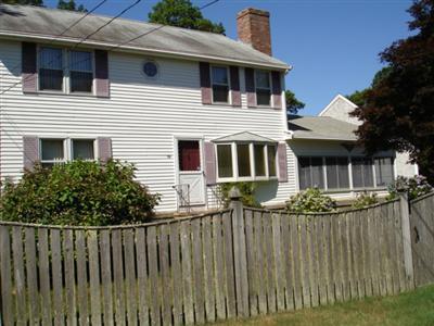 79 Harbor Hills Road Centerville, MA 02632 - Photo 1 of 7 a front view of a house with a garden