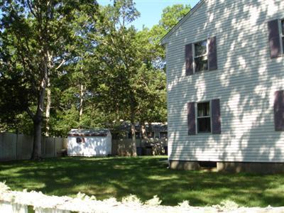 79 Harbor Hills Road Centerville, MA 02632 - Photo 4 of 7 a front view of a house with a yard
