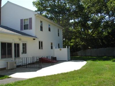 79 Harbor Hills Road Centerville, MA 02632 - Photo 5 of 7 a front view of a house with a yard