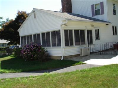 79 Harbor Hills Road Centerville, MA 02632 - Photo 6 of 7 a view of a house with a yard and plants