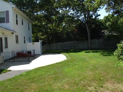 79 Harbor Hills Road Centerville, MA 02632 - Photo 7 of 7 a view of a backyard with a small cabin