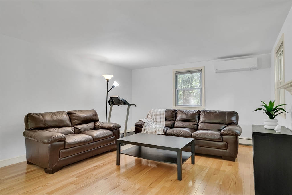 32 Dewey Road Lexington, MA 02420 - Photo 10 of 32 a living room with furniture and a potted plant