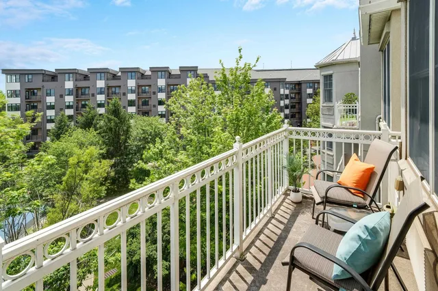 a view of balcony with furniture