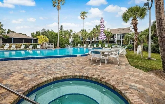 a view of a swimming pool with a patio