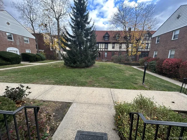 a view of a patio with a yard