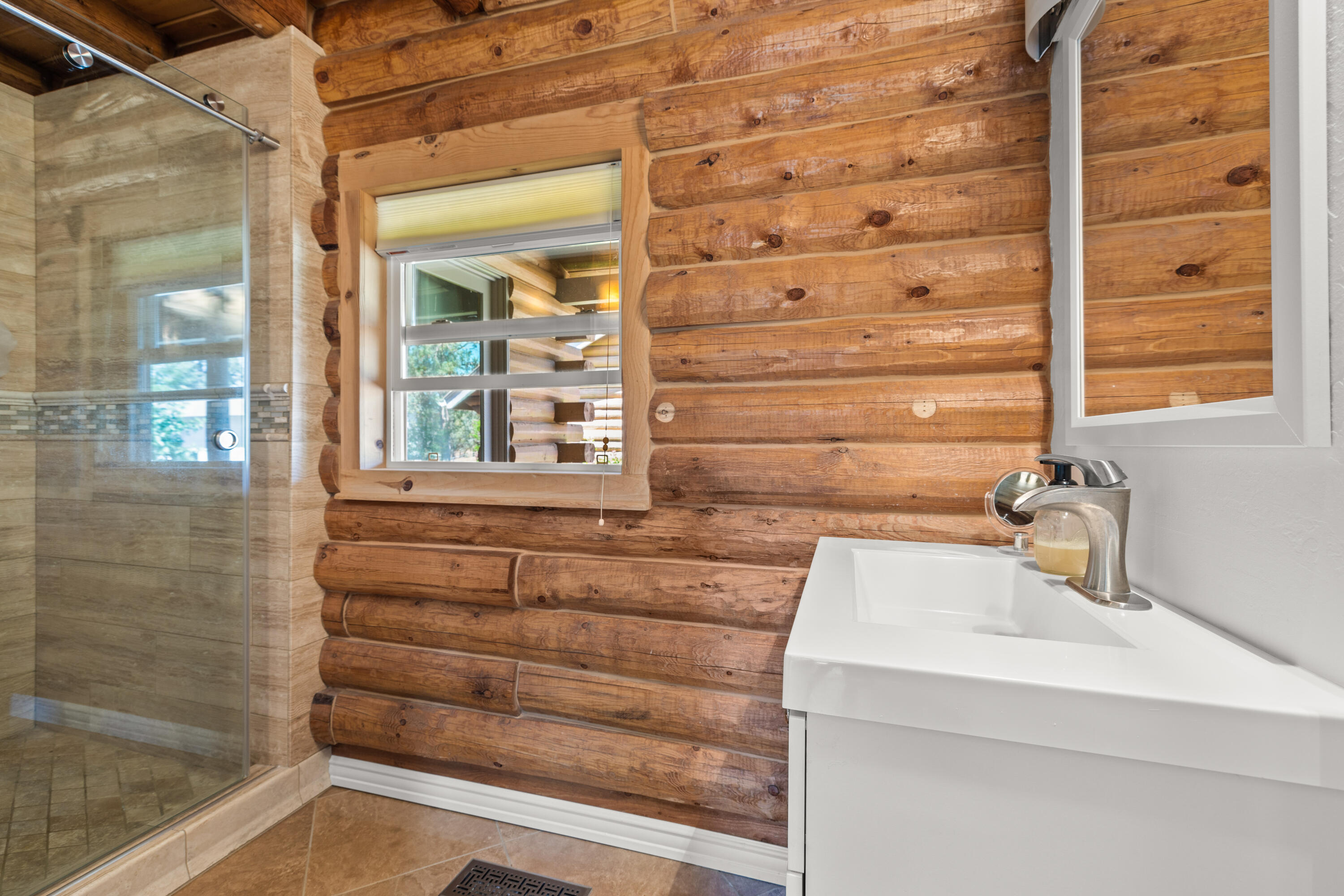 18460 Couch Market Road Bend, OR 97703 - Photo 18 of 51 a bathroom with a sink and a mirror