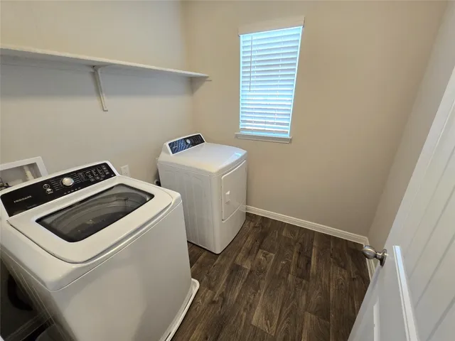 a bathroom with a sink toilet and a mirror