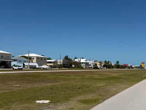 a view of outdoor space with signage and flags