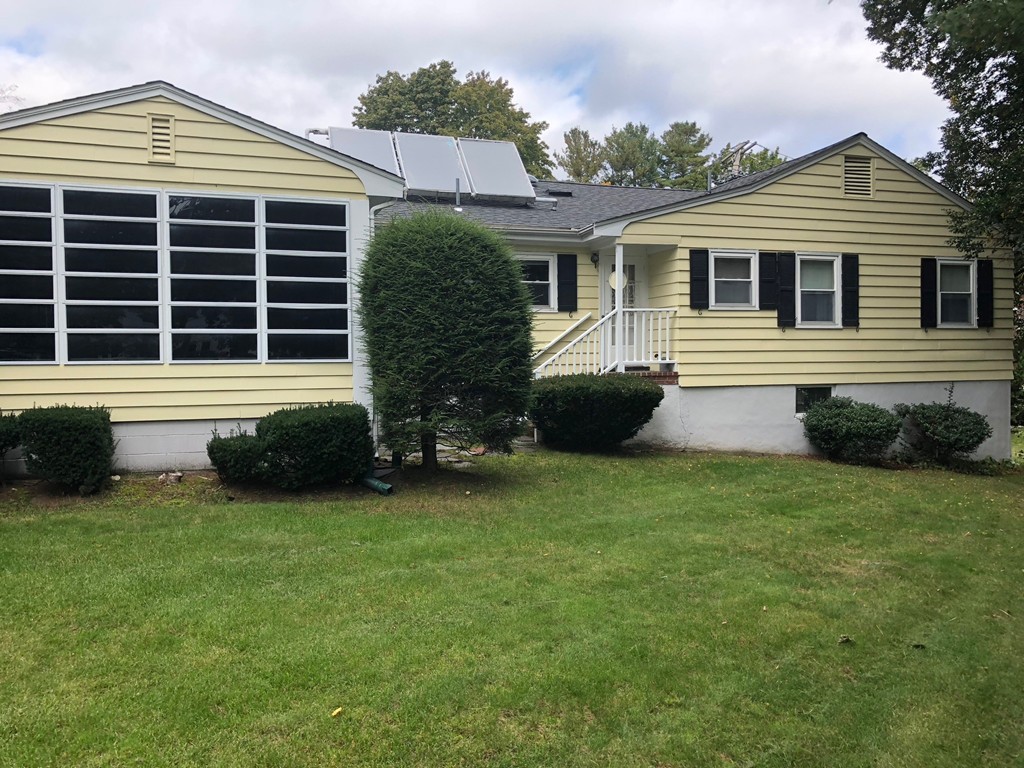 210 Evelyn Road Newton, MA 02468 - Photo 3 of 3 a house view with a garden space