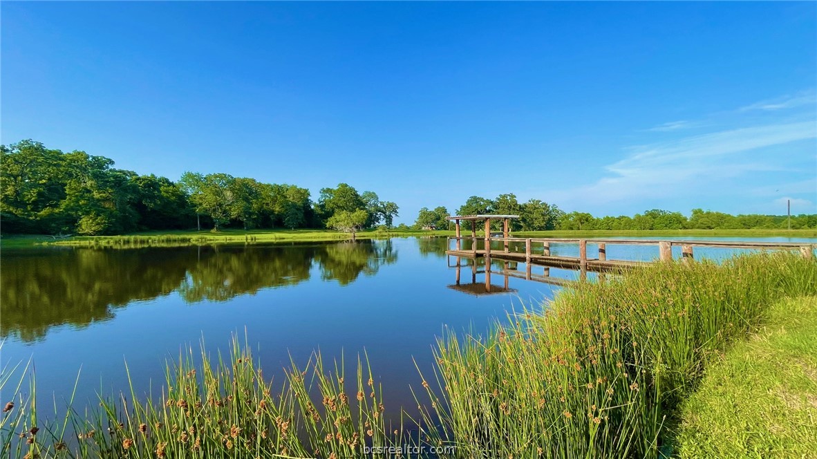Tbd Tbd Wilson Pasture Road Bryan, TX 77808 - Photo 15 of 29 a view of a lake with houses in the back
