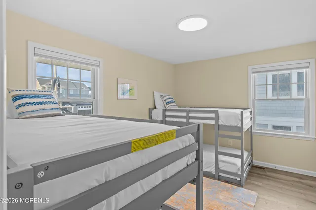 a bedroom with a bed and a table