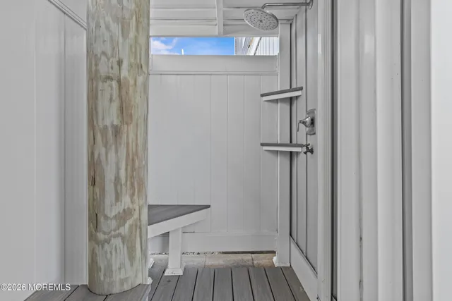 a view of a room with wooden floor