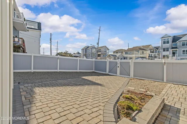 a living room with furniture and a ceiling fan
