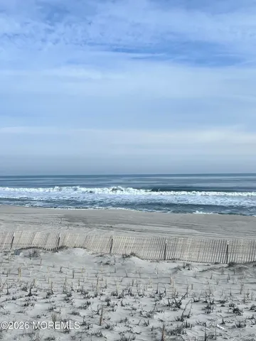 a view of a wooden table with kitchen