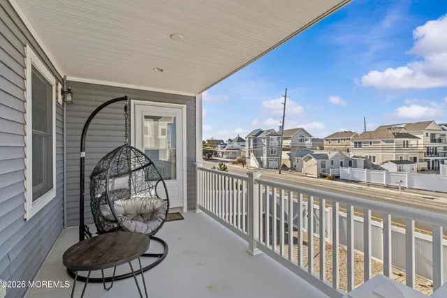 a view of a living room and balcony