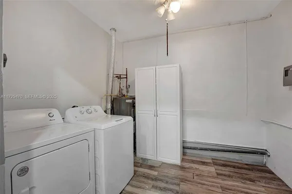 a bathroom with a granite countertop sink a toilet a shower and a mirror