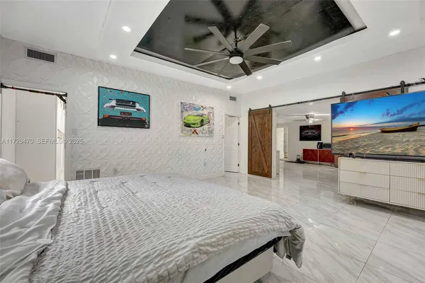 a bathroom with a granite countertop sink mirror and