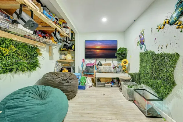 a living room with fireplace furniture and a flat screen tv