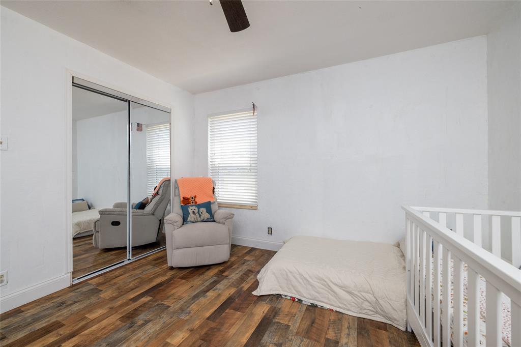 151 County Road 3699 Springtown, TX 76082 - Photo 13 of 35 Room with wood-finish flooring, white walls, and a ceiling fan