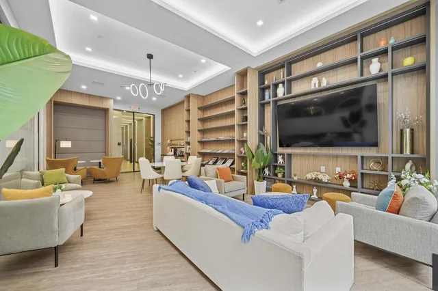 a living room with fireplace furniture and a flat screen tv