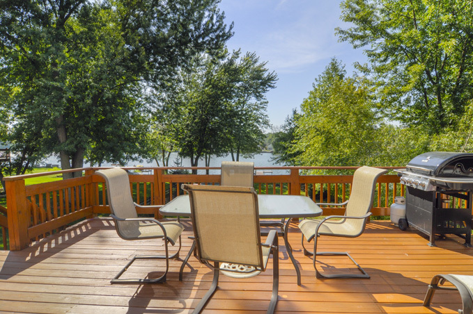 732 Robertson Road South Elgin, IL 60177 - Photo 2 of 37 a view of a patio with table and chairs with wooden floor and fence