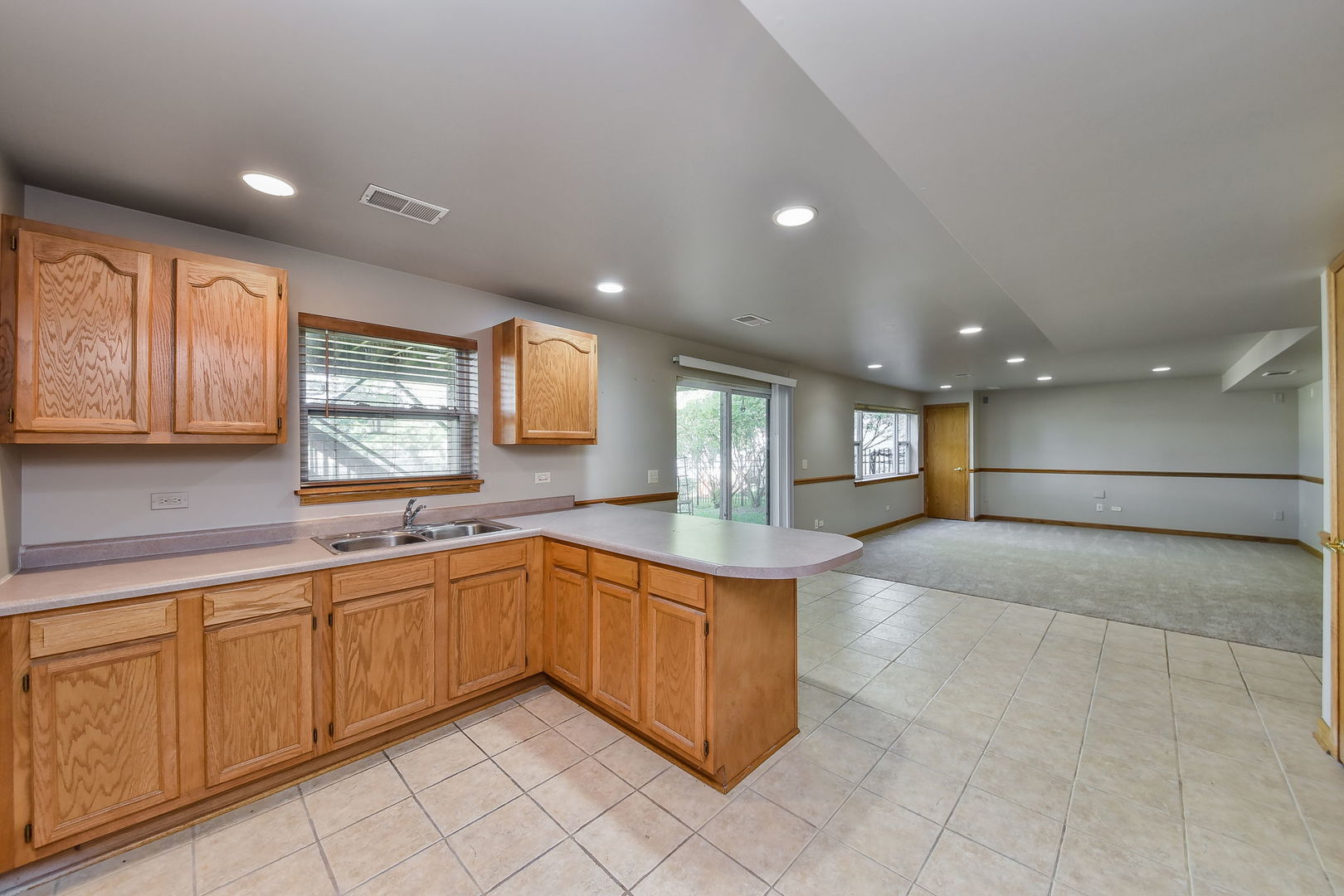 732 Robertson Road South Elgin, IL 60177 - Photo 19 of 37 a large kitchen with stainless steel appliances granite countertop a sink and cabinets