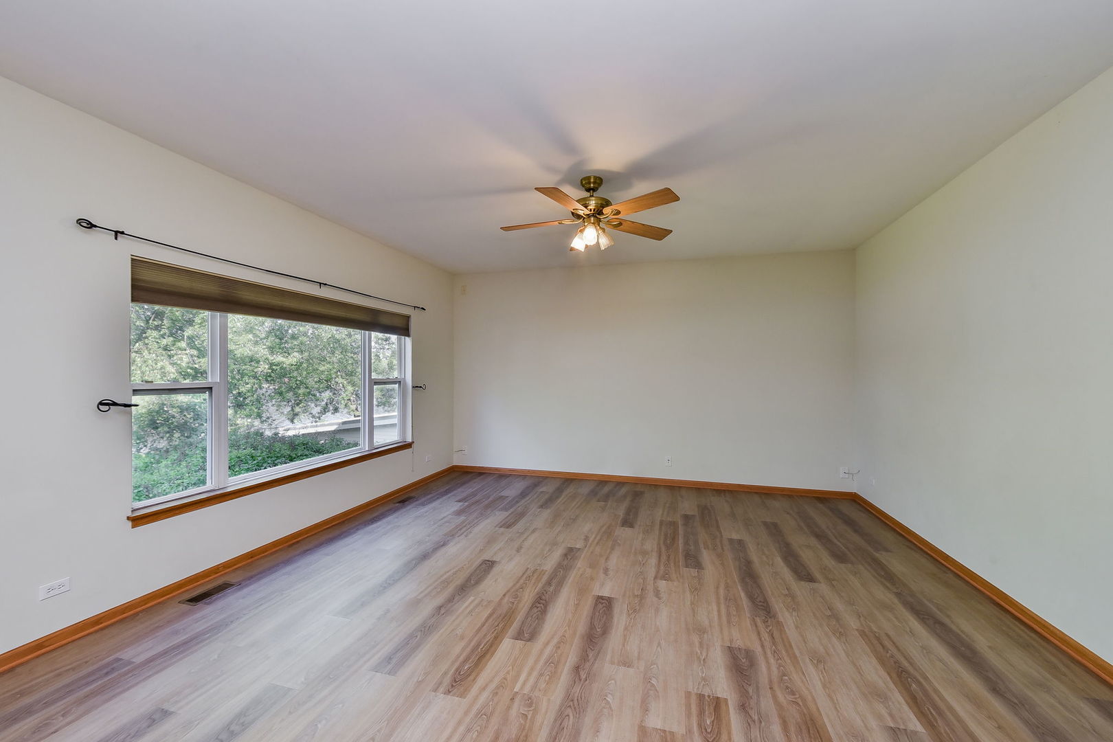 732 Robertson Road South Elgin, IL 60177 - Photo 3 of 37 wooden floor in an empty room with a window