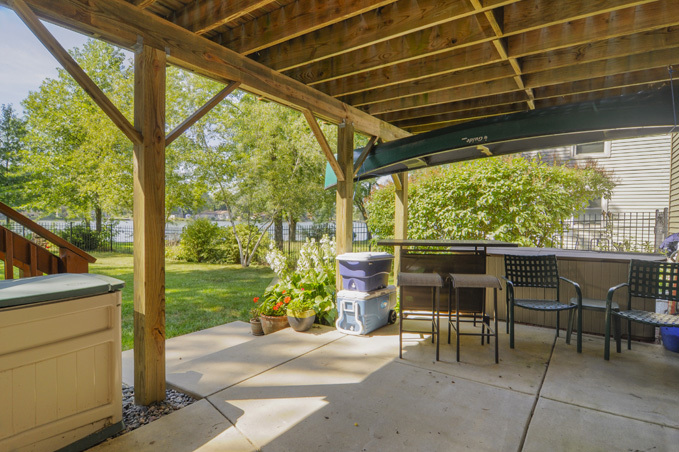 732 Robertson Road South Elgin, IL 60177 - Photo 22 of 37 a patio with table and chairs and couches with wooden floor and fence
