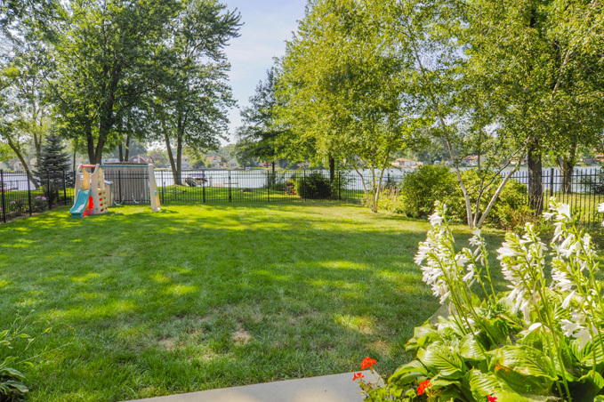 732 Robertson Road South Elgin, IL 60177 - Photo 23 of 37 a view of a house with a big yard and large trees