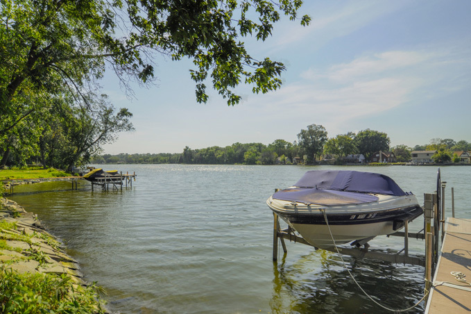 732 Robertson Road South Elgin, IL 60177 - Photo 25 of 37 a view of a lake with a table and chairs