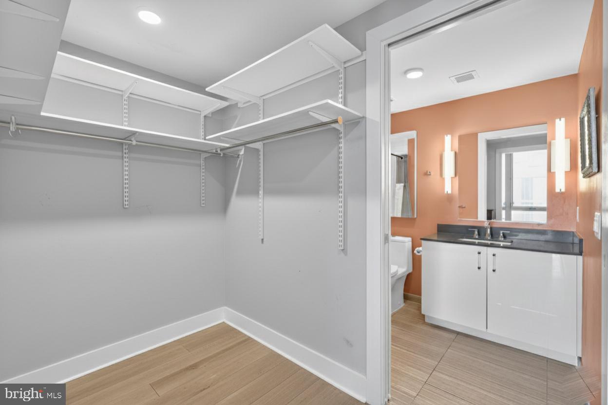 88 V Street Southwest, Unit 313 Washington, DC 20024 - Photo 12 of 38 a bathroom with a sink and a mirror