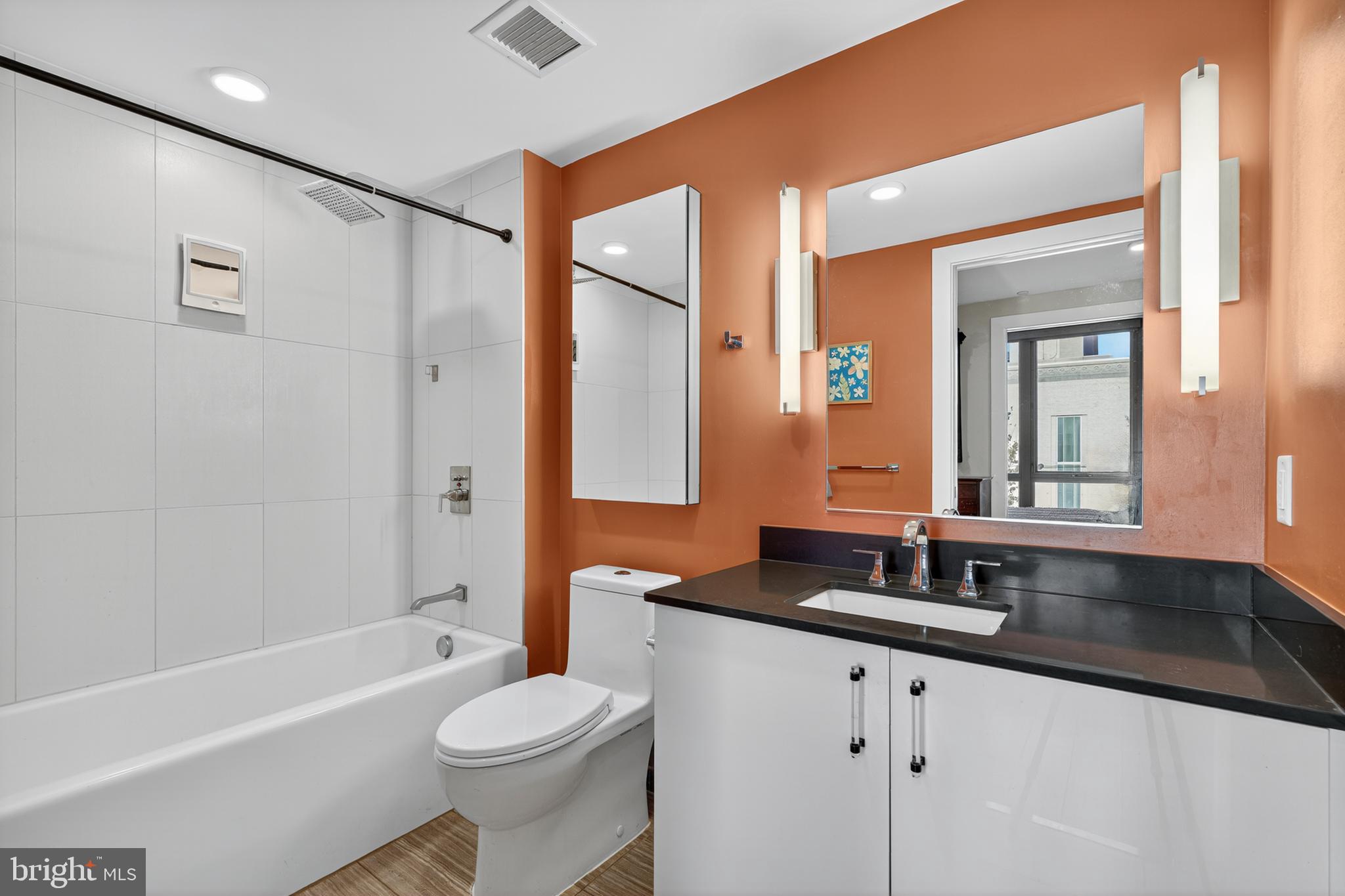88 V Street Southwest, Unit 313 Washington, DC 20024 - Photo 13 of 38 a bathroom with a granite countertop sink toilet and shower