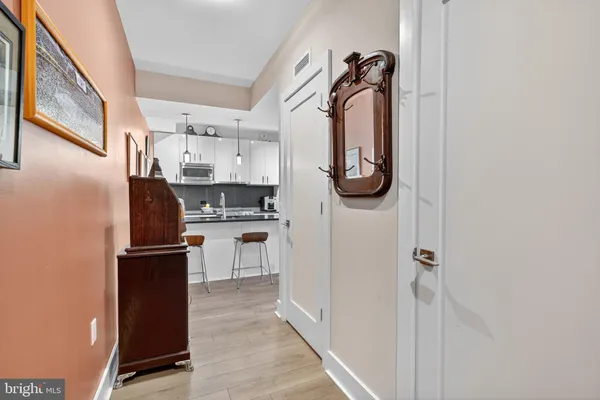 a kitchen with a refrigerator and cabinets