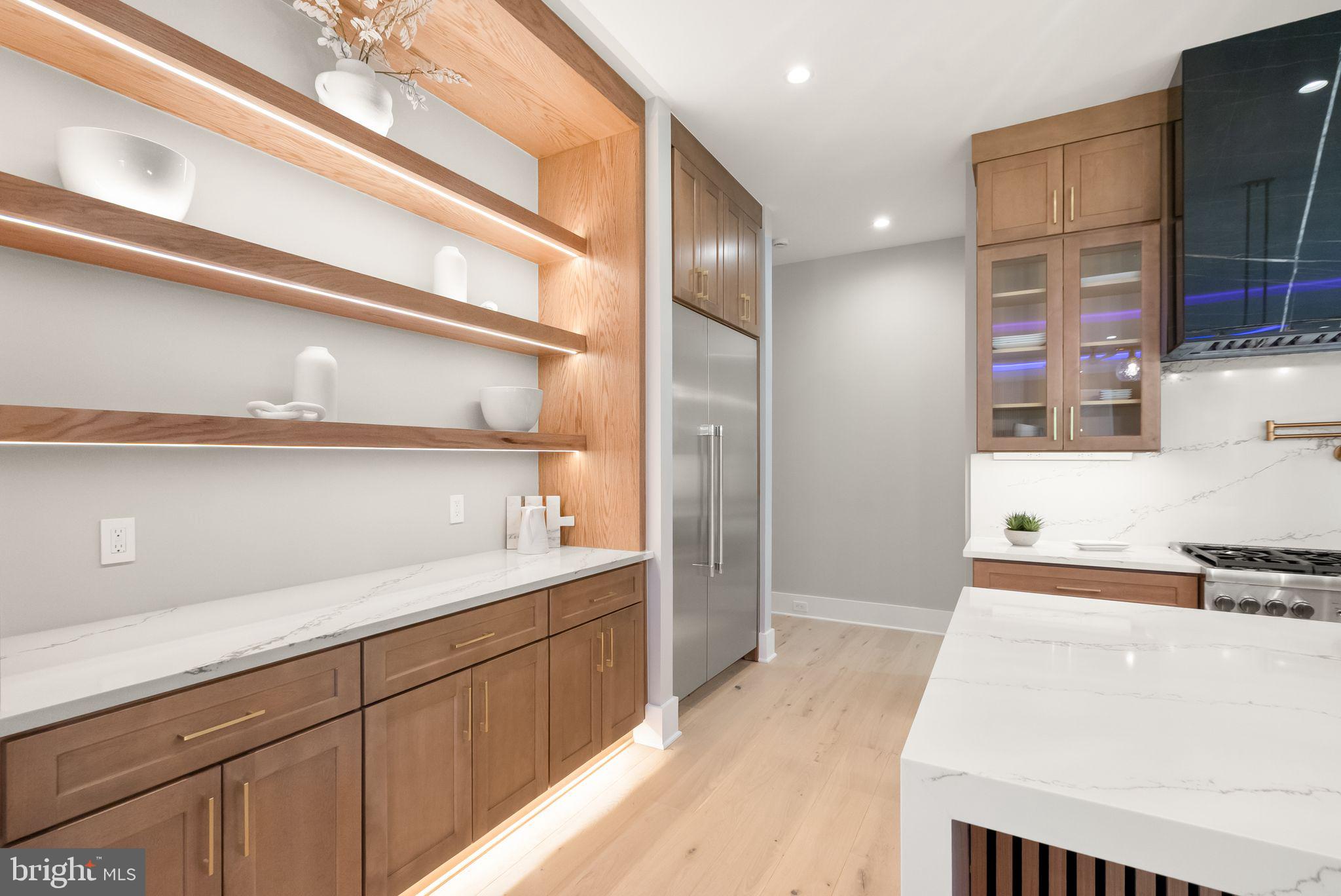 6329 Halsey Road McLean, VA 22101 - Photo 20 of 94 Sleek modern kitchen with warm tones.