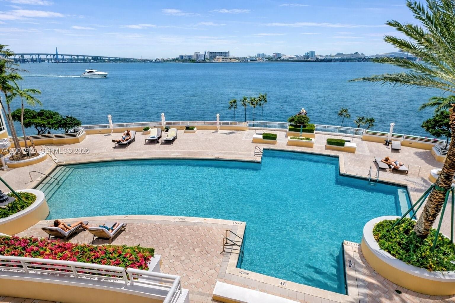 848 Brickell Key Drive, Unit 905 Miami, FL 33131 - Photo 28 of 28 a view of a house with yard and lake view