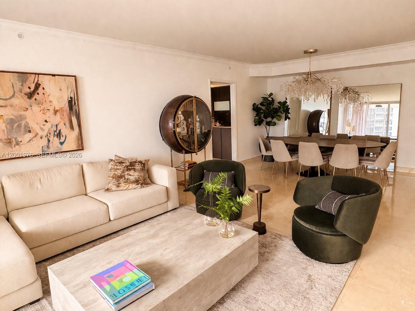848 Brickell Key Drive, Unit 905 Miami, FL 33131 - Photo 3 of 28 a living room with furniture and a large window