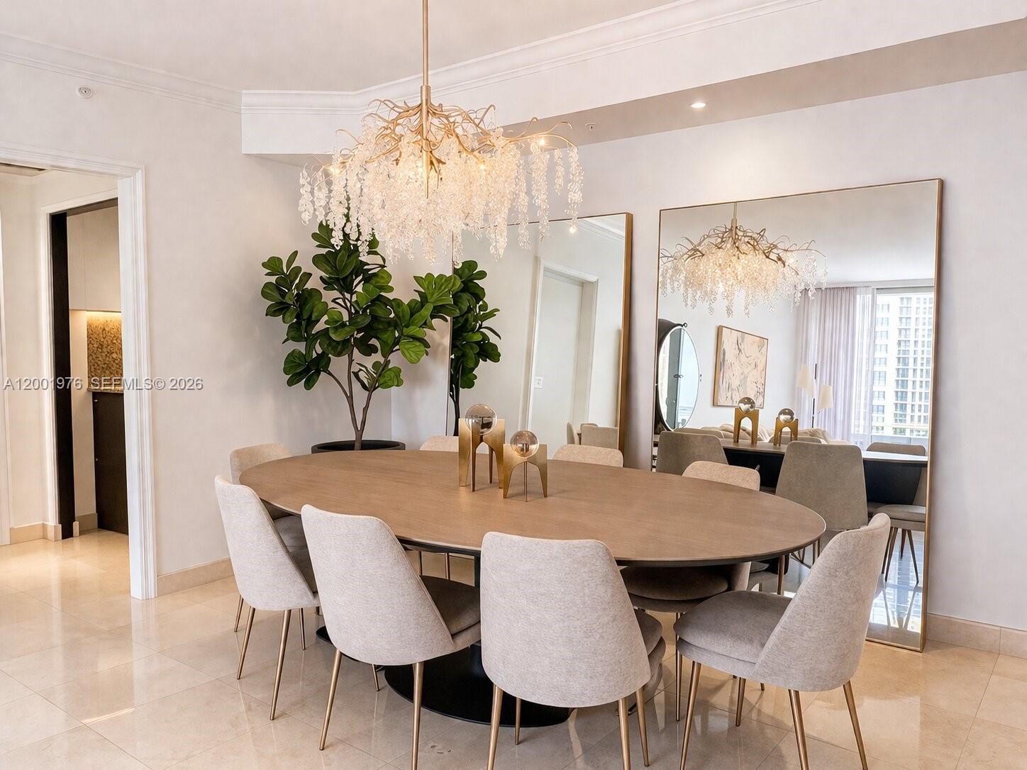848 Brickell Key Drive, Unit 905 Miami, FL 33131 - Photo 5 of 28 a view of a dining room with furniture and window