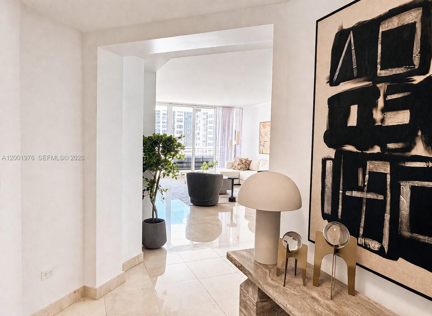 848 Brickell Key Drive, Unit 905 Miami, FL 33131 - Photo 6 of 28 a view of a living room and dining room