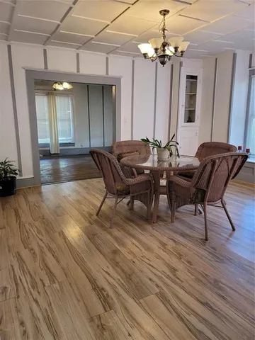 a view of a livingroom with furniture and a mirror