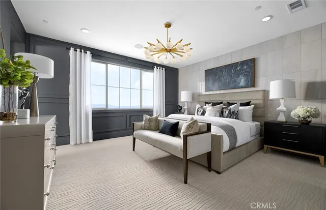 a bedroom with a bed and a couch