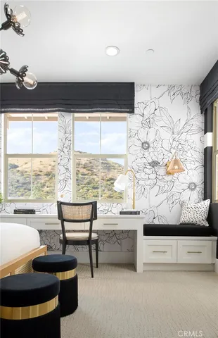 a living room with fireplace furniture and a large window